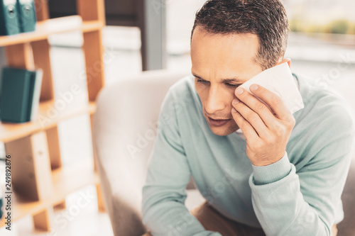 Mature man suffering from strong migraine