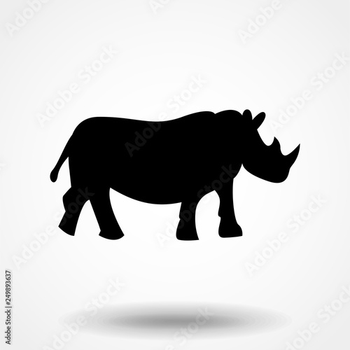 Vector illustration of a silhouette of a rhino standing on isolated white background. Rhinoceros side view profile. © OLGA