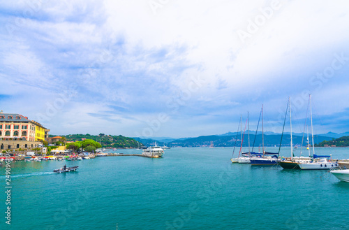 Gulf of Spezia turquoise water with yachts and boats from Portovenere coastal town and blue cloudy dramatic sky copy space background, Ligurian sea, Riviera di Levante, La Spezia, Liguria, Italy © Aliaksandr
