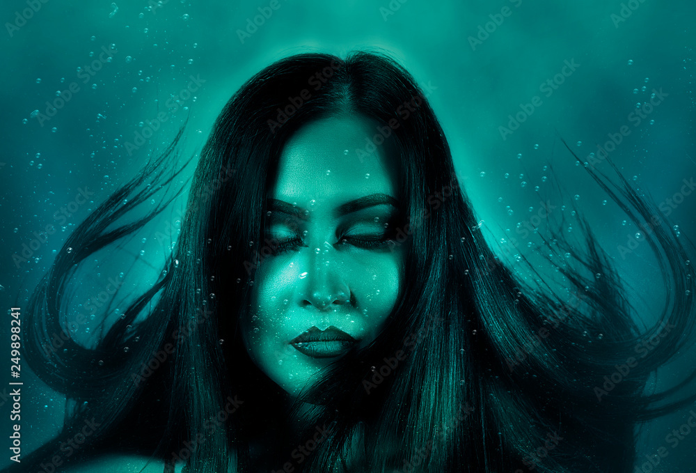 Portrait woman floats underwater Portrait woman floats underwater