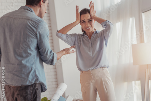 Fotografi Nervous woman having a conflict with her husband