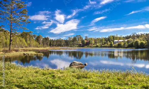Fototapeta Naklejka Na Ścianę i Meble -  reflection of clouds in a swedish lake on a beautiful summer day