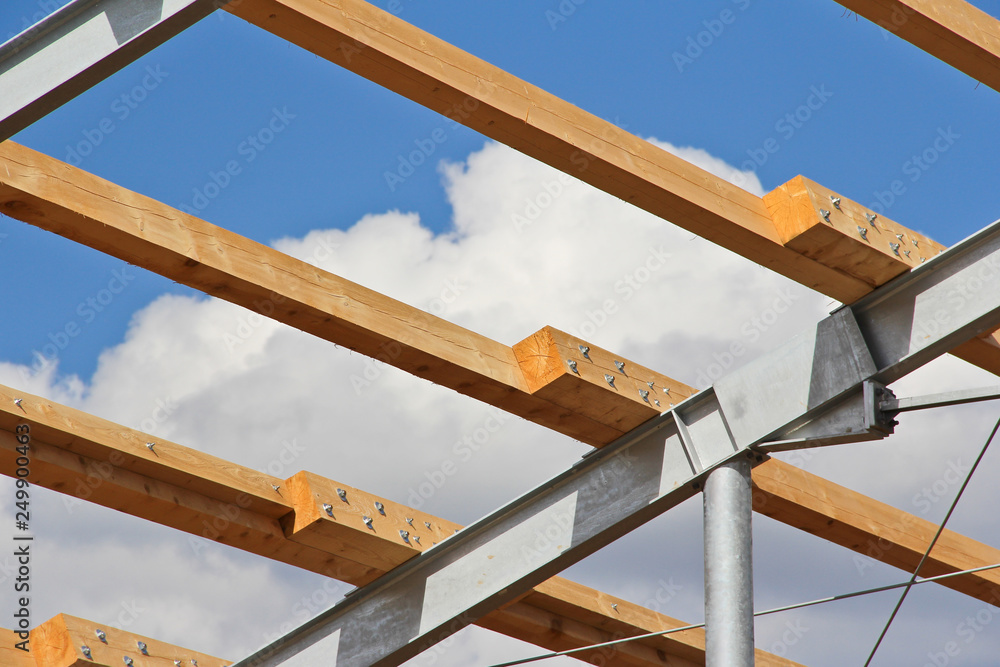 Fototapeta premium Structure of steel for building construction with wooden beams