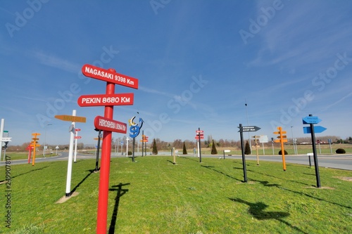 Direction signs in wood showing the distance of the main towns of the world Fototapeta