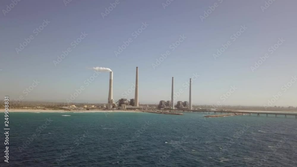 Coal and Gas fired power station - Aerial view including a Flue-Gas chimney Coal and Gas fired power station - Aerial view including a Flue-Gas chimney