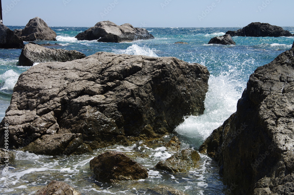 Storm of the sea on the stone beach.