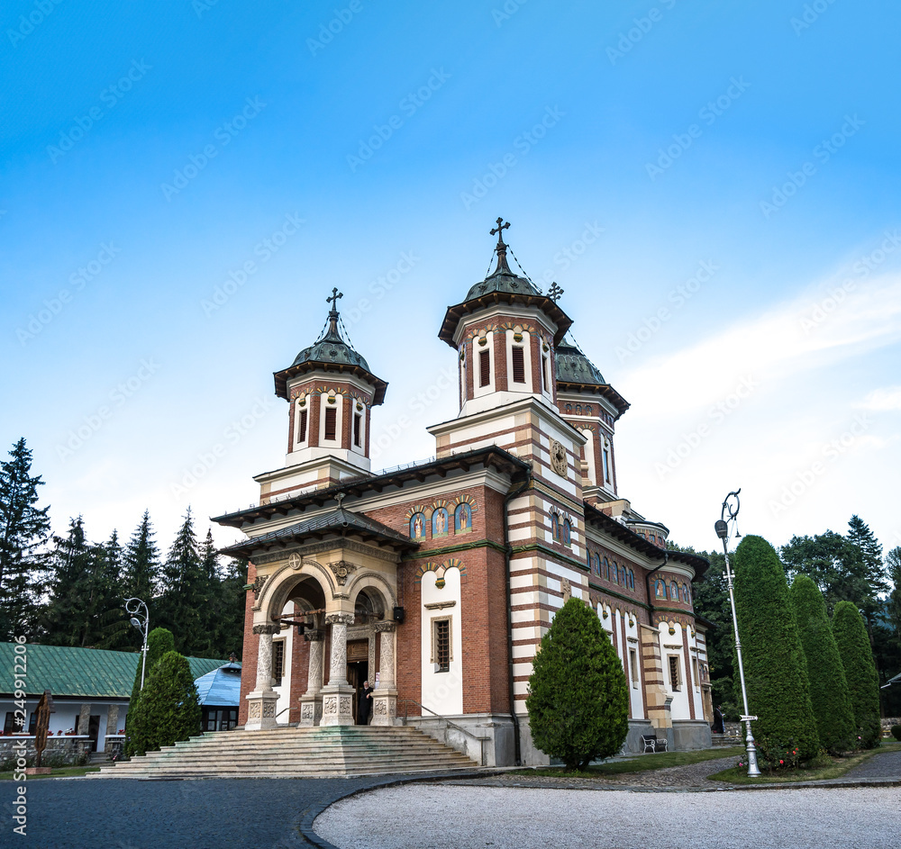 Romanian traditional Christian church with blue sky in Sinaia Romania. 