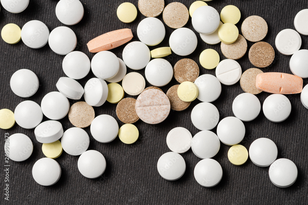 Heap of colorful medication on black background. Heap of colorful medication on black background.