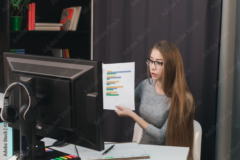 business woman shows graphs online via computer business woman shows graphs online via computer