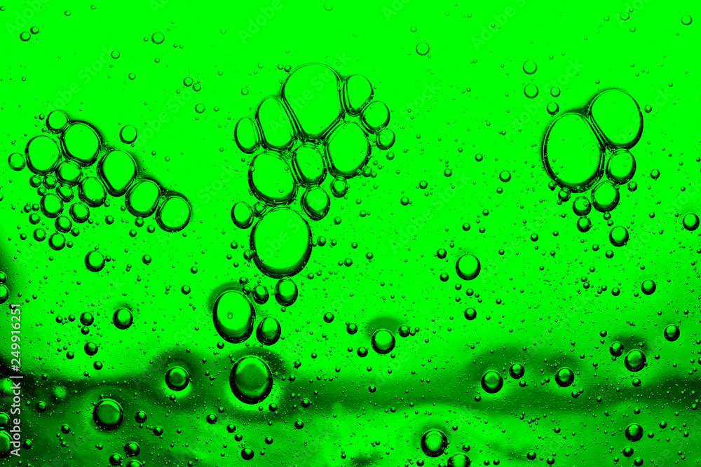 abstract background of bright green bubbles closeup