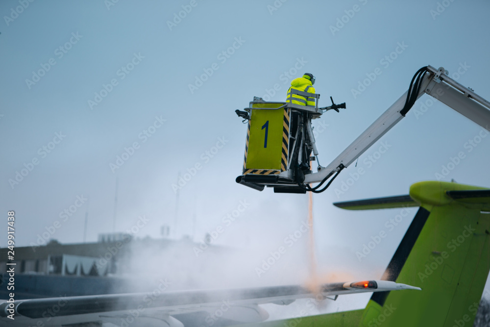 Deicing of airplane before flight at the airport