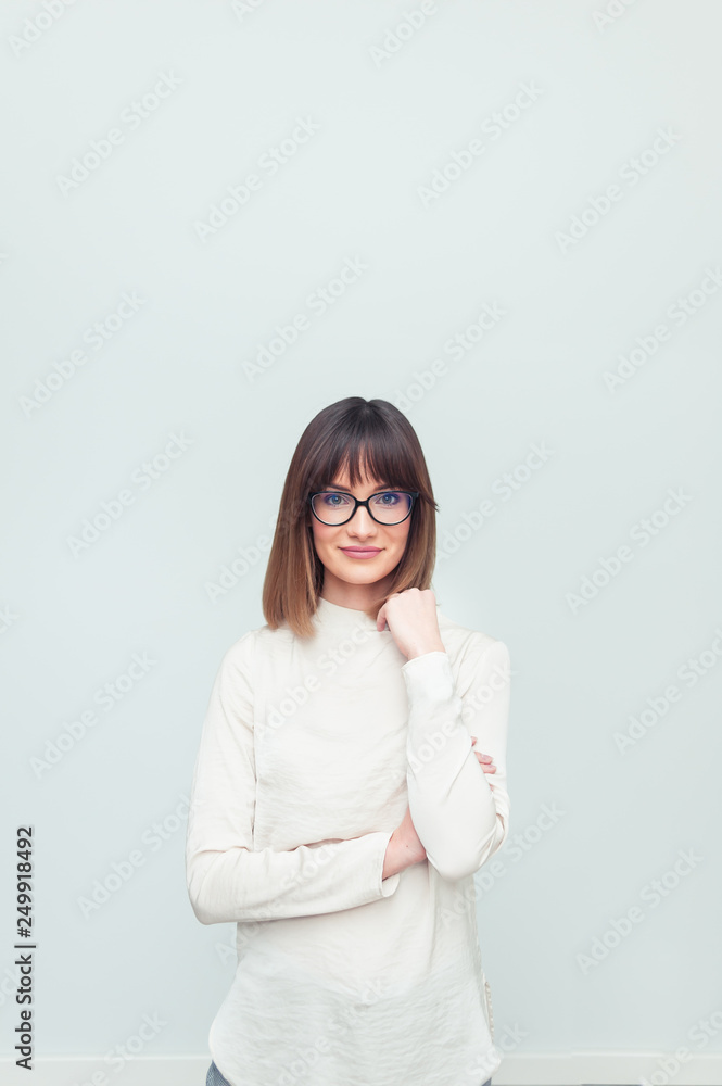 Portrait of beautiful woman in eyeglasses in office company Portrait of beautiful woman in eyeglasses in office company