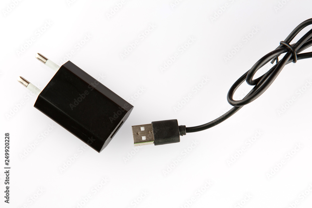 Black electrical adapter to USB port on a white background Black electrical adapter to USB port on a white background