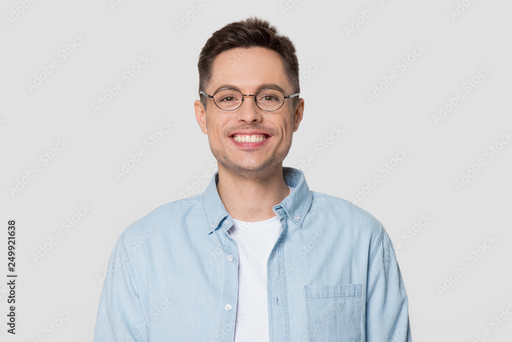 Smiling man wearing glasses looking at camera isolated on background Smiling man wearing glasses looking at camera isolated on background