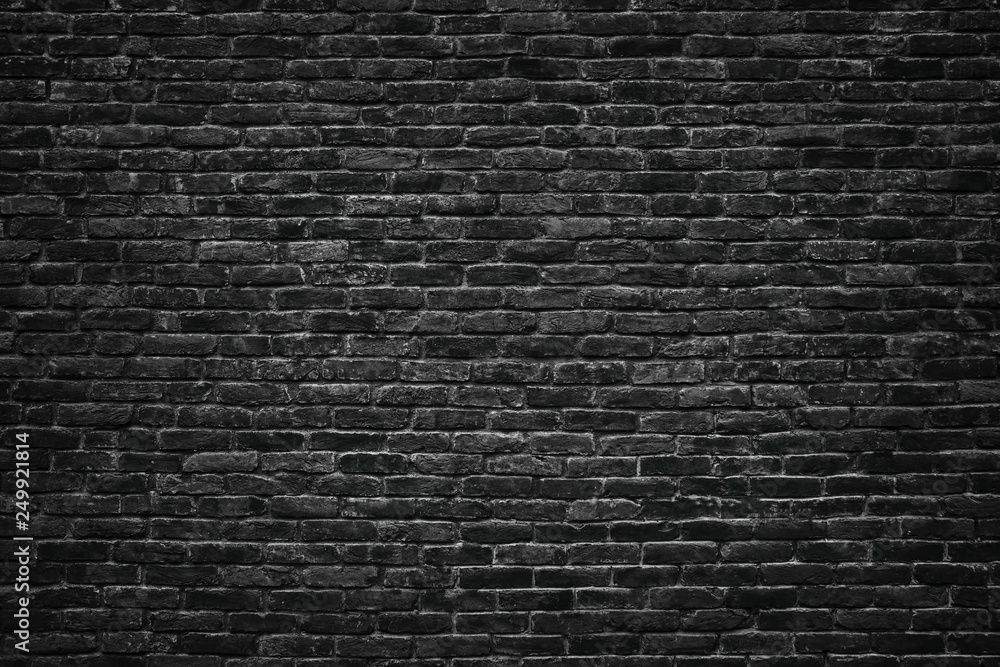 black brick wall texture. dark stone surface, background for design