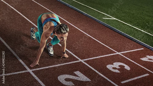 Obraz Tła sportowe. Sprinter startujący na arenie sportowej.