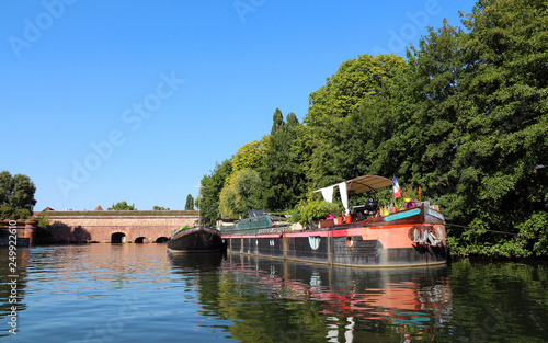 Barge near old bridge "Barrage Vauban" in Strasbourg - France