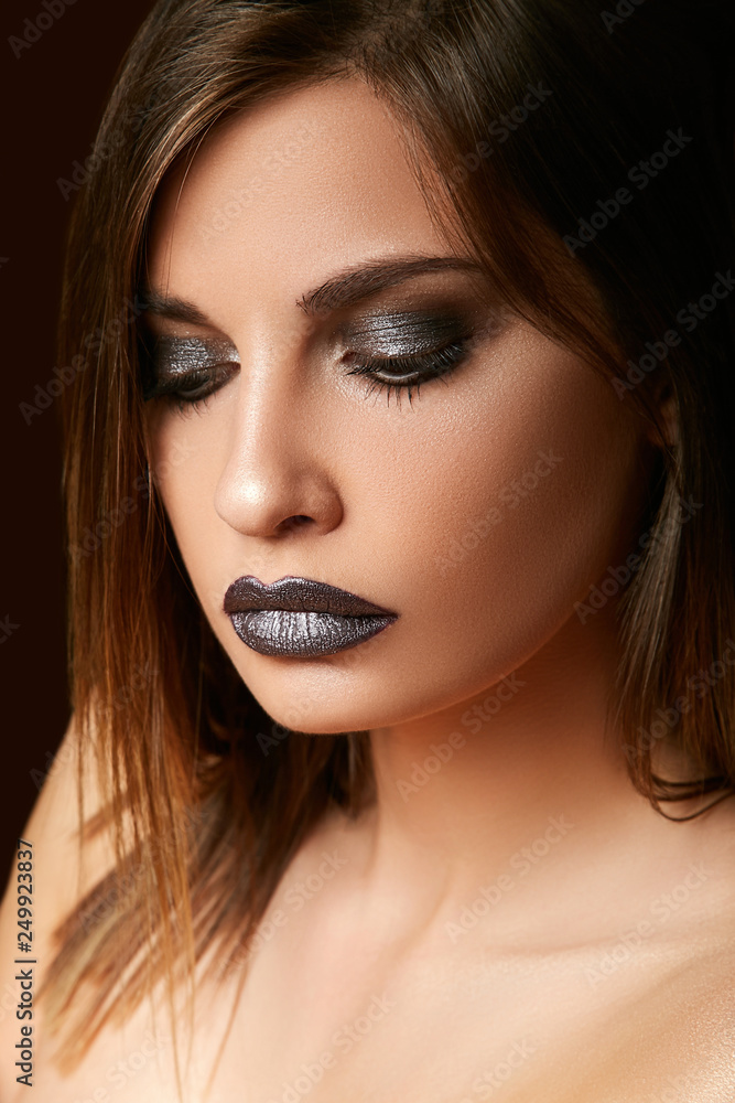 Young modest girl looked down. Unusual evening makeup. Young modest girl looked down. Unusual evening makeup.