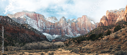 Panorama of giant cliffs covered in snow in zion