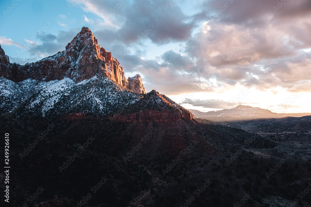Photo of snowy mountain at sunset in zion