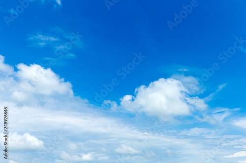 blue sky background with tiny clouds