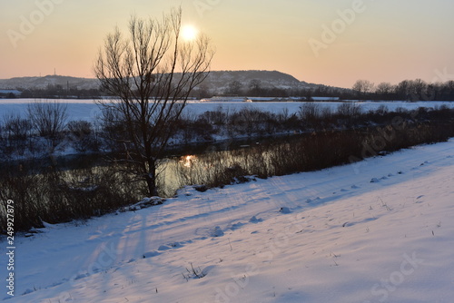 Winter mountain landscape with frozen river and sunset  Si    Hungary