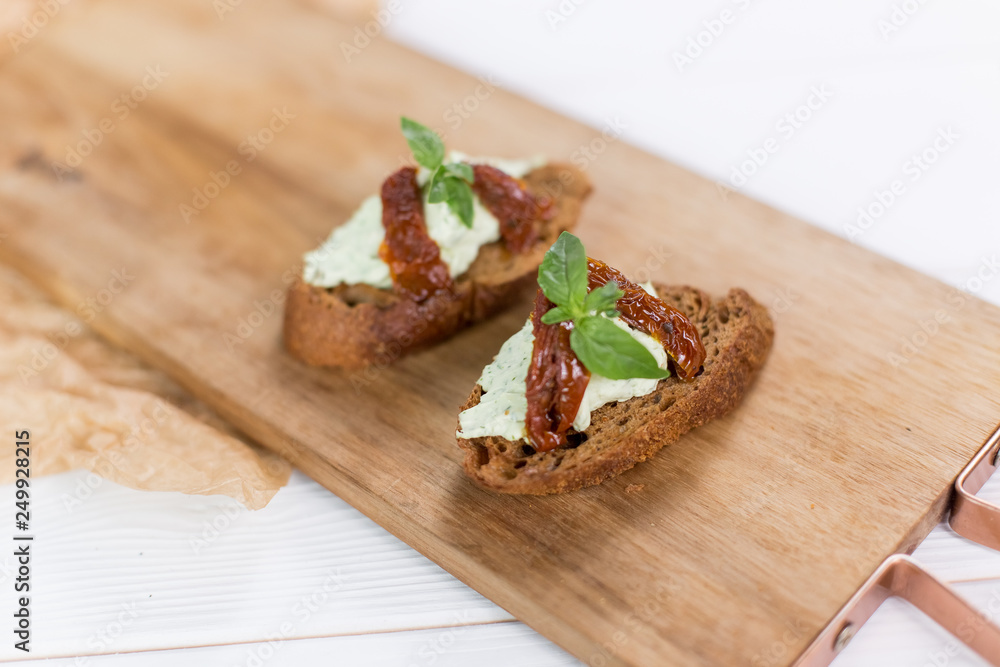 Bruschetta with cheese cream and tomatoes. Food photo for menu Bruschetta with cheese cream and tomatoes. Food photo for menu