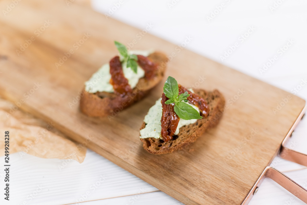 Bruschetta with cheese cream and tomatoes. Food photo for menu Bruschetta with cheese cream and tomatoes. Food photo for menu