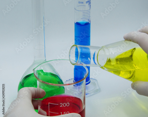 Tableau sur toile Laboratory technician conducts experiments, white background