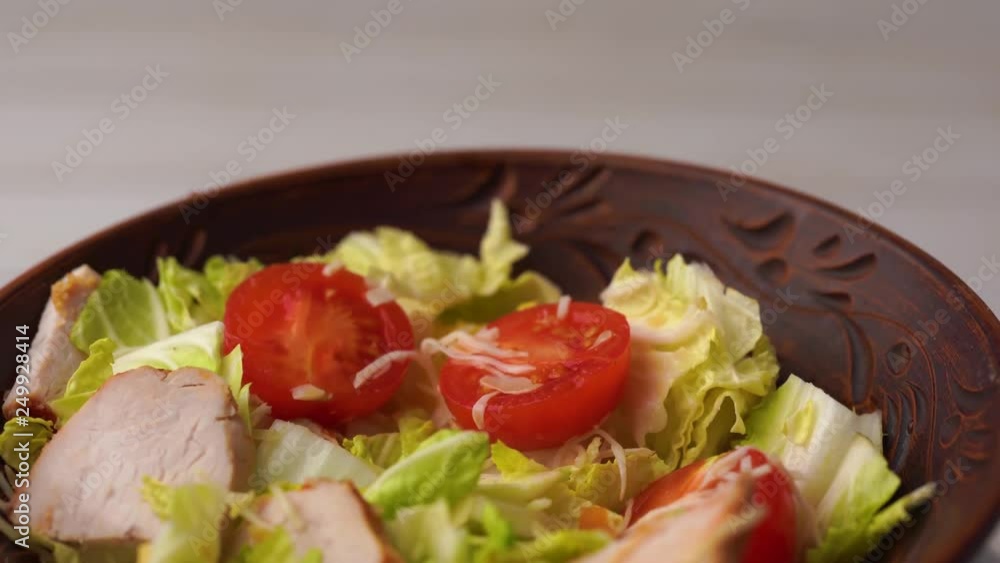 Vegetables in a salad, vegetable salad with Turkey. Cabbage and red tomatoes. Concept: healthy and low-calorie feeding. Diet products Vegetables in a salad, vegetable salad with Turkey. Cabbage and red tomatoes. Concept: healthy and low-calorie feeding. Diet products