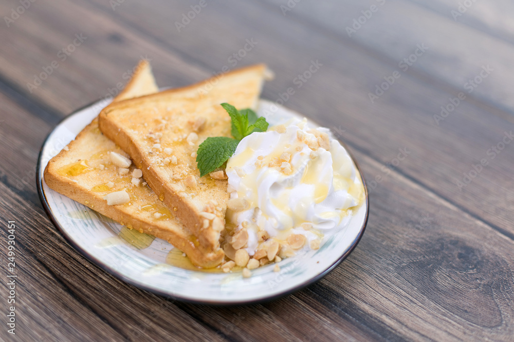 Tasty sandwich with cream, nuts and honey on wooden background Tasty sandwich with cream, nuts and honey on wooden background