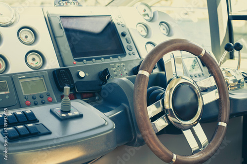 Steering wheel and control panel on a luxury yacht © Ирина Селина