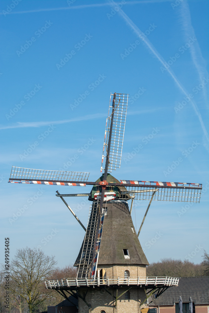 Spring landscape with traditional Dutch windmill in Brabant