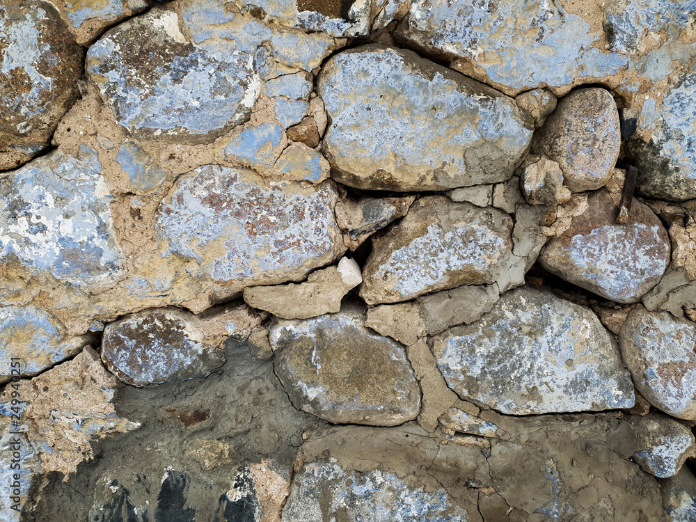 Wall of clay and stones close-up. Cobblestone Wall Wall of clay and stones close-up. Cobblestone Wall