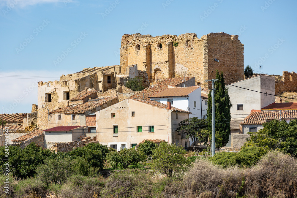 old rustic houses and  ruins of an ancient church in Plou town, province of Teruel, Aragon, Spain