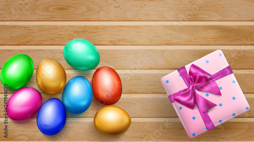 Realistic colored Easter eggs, tasty cake and beautiful gift box with bow on wooden planks