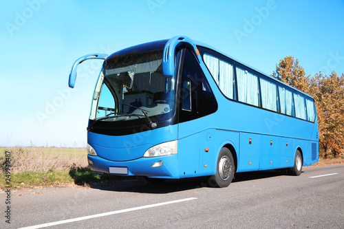 Modern blue bus on road. Passenger transportation