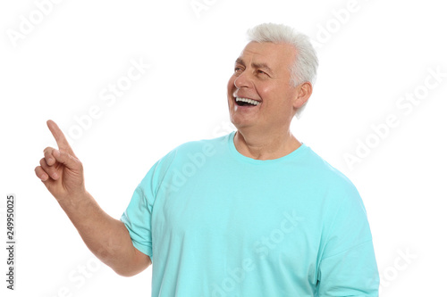 Portrait of mature man laughing on white background