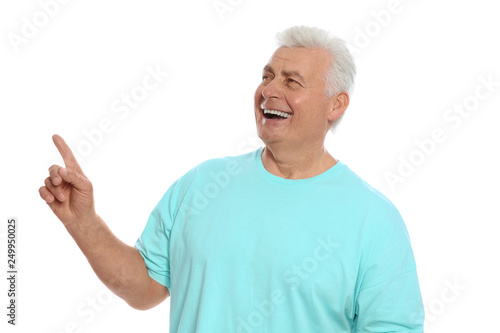 Portrait of mature man laughing on white background © New Africa