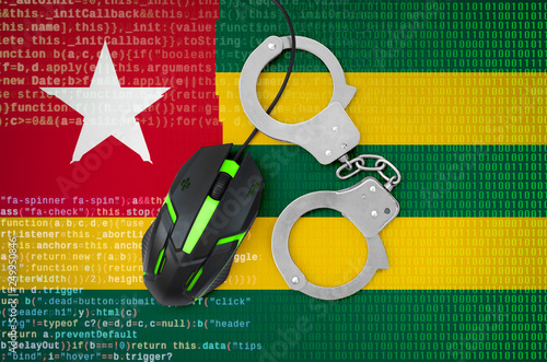 Togo flag  and handcuffed computer mouse. Combating computer crime, hackers and piracy photo