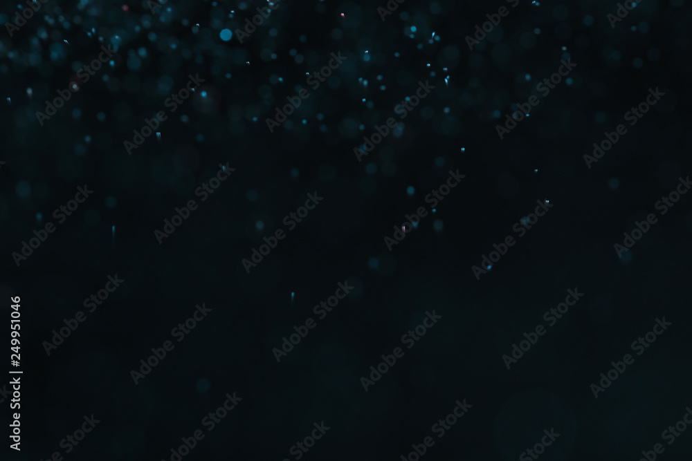 Magic blue bokeh effect on dark background Magic blue bokeh effect on dark background