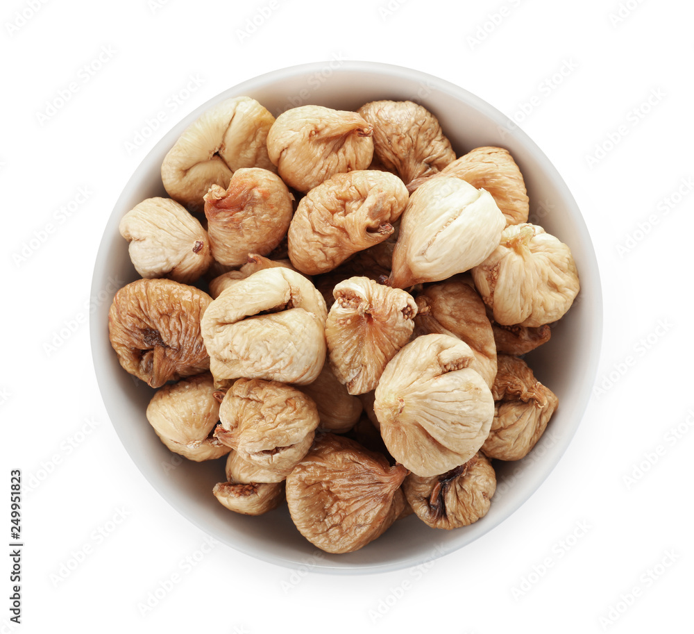 Bowl with figs on white background, top view. Dried fruit as healthy food Bowl with figs on white background, top view. Dried fruit as healthy food