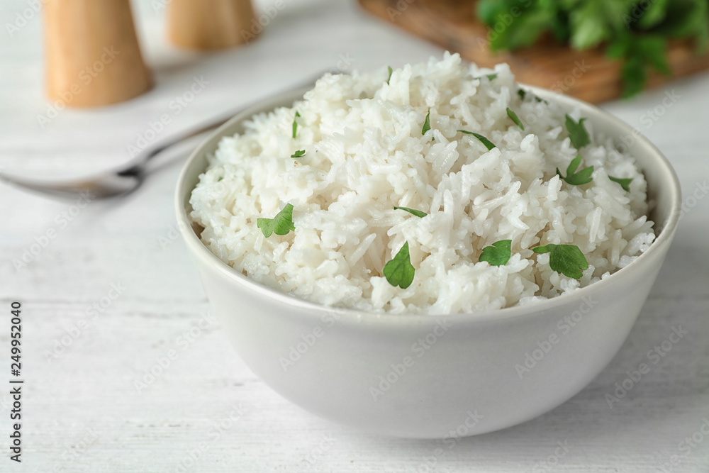 Bowl of boiled rice on table, closeup Bowl of boiled rice on table, closeup