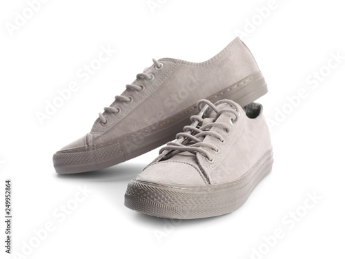 Pair of stylish sneakers on white background