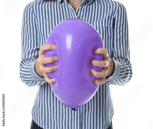 Fotografia Woman squeezing purple balloon on white background, closeup