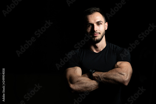 Handsome Personal Trainer Wearing Sportswear In Fitness Center