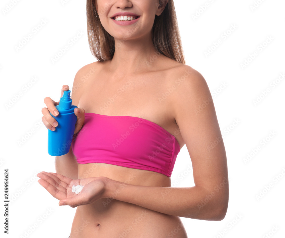 Woman applying sun protection cream on body against white background, closeup Woman applying sun protection cream on body against white background, closeup
