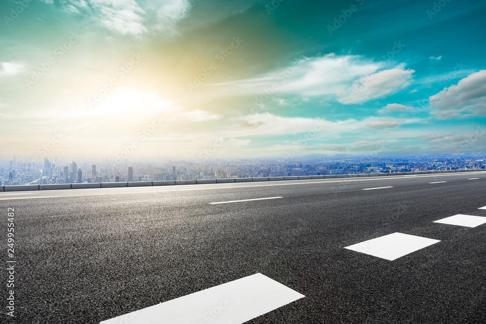 Fototapeta premium Panoramic city skyline and buildings with empty asphalt road in Shanghai