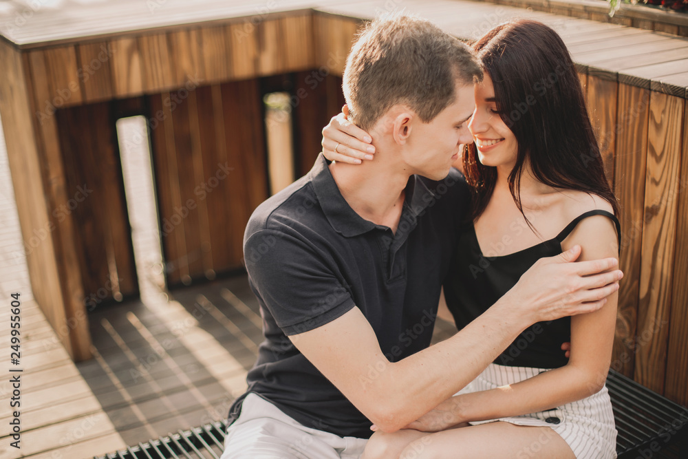 Loving couple hugging in the street. Loving couple hugging in the street.