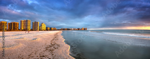 Sunset and clouds over the calm water of Tigertail Beach on Marco Island photo